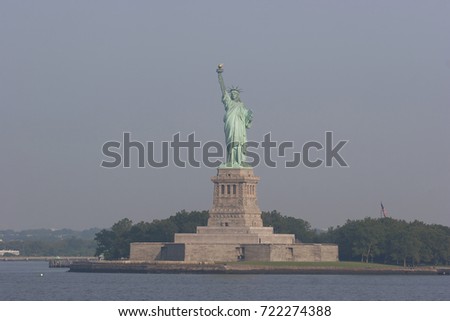 statue of liberty illuminated by early morning sunlight