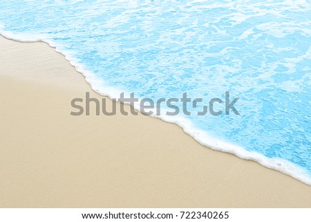 close up photography - Tropical Blue sea water coming on the white beach sand