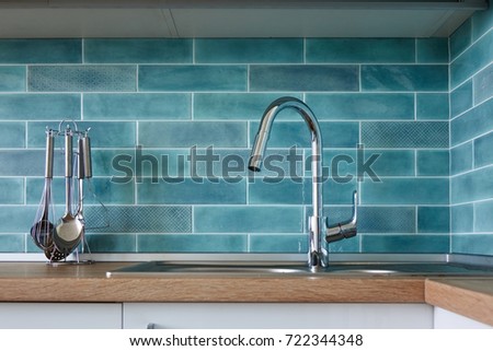 Modern kitchen, a picture of a faucet
