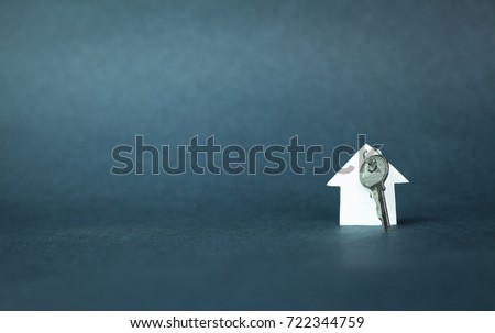 House and key on a blue background.