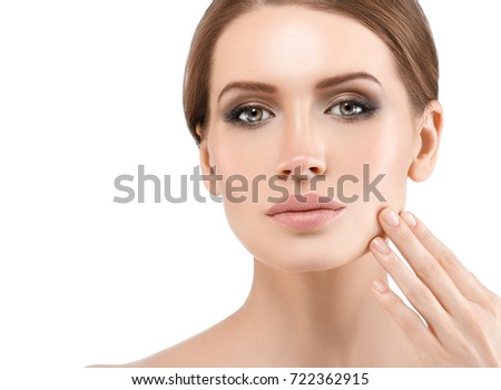 People, Beauty Woman face Portrait with healthy nails and hand touching face. Beautiful Spa model with Perfect Fresh Clean Skin. Brunette female looking camera and smiling. Youth and Skin Care Concept