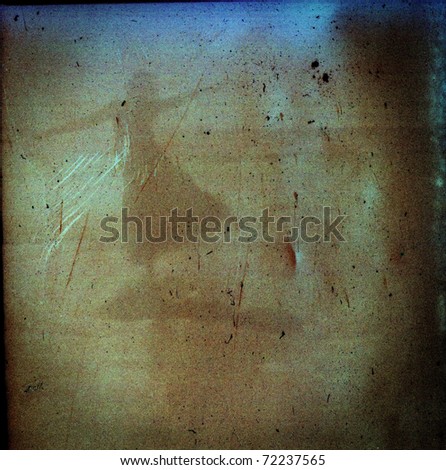 Grungy medium format film frame with a dancing girl silhouette