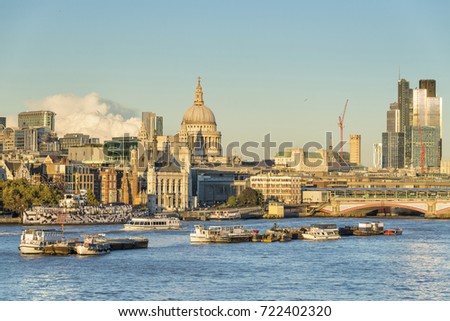 Sunny clear afternoon at River Thames with St Pauls Cathedral in the background