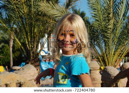The girl on the face painted butterfly
