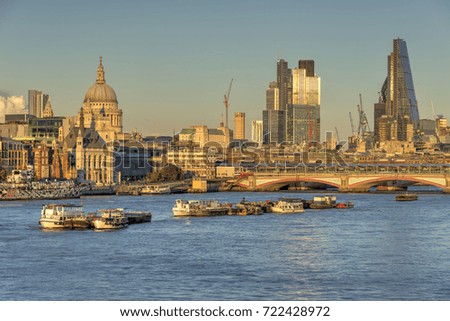 London skyline in late afternoon colours with St Pauls Cathedral and skyscrapers in the background