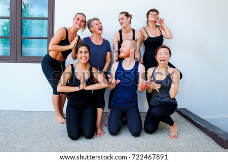 Female yoga students and their yoga teacher.