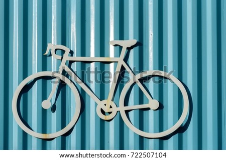 Bicycle logo on blue zinc wall ,  Cycling concept,  Bike Hobby Icon Symbol.