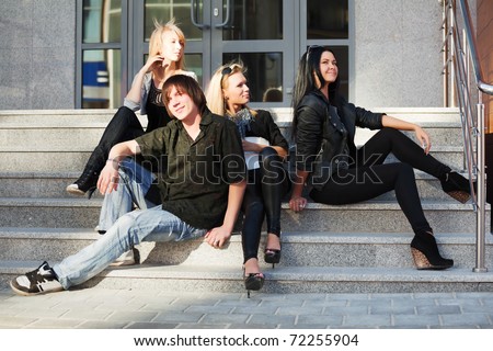 Teens relaxing on the steps
