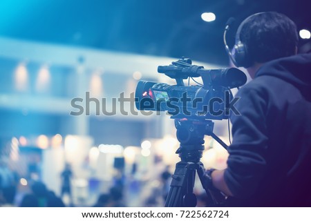 Professional video technician.Videographer by event. Royalty-Free Stock Photo #722562724