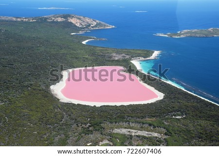 Lake Hillier, Western Australia: Amazing pink lake, natural landmark of Australia, in Middle Island, Recherche Archipelago Nature Reserve, near Esperance. Royalty-Free Stock Photo #722607406