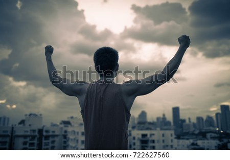 People power, and overcoming adversity. Strength in the midst of a storm.  Royalty-Free Stock Photo #722627560