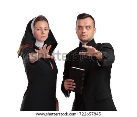 Strange priest holds the Bible in his hands together with nun, isolated on a white background. Religion concept.