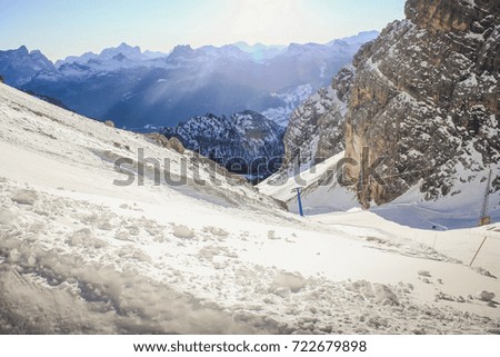 Mountain Range. Winter snow peaks, ski run in Italian. Snowy winter landscape of a ski resort in the Alps