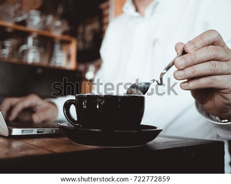 Business man holding a coffee cup, start up, morning concept