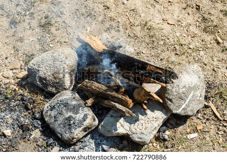 Fire of wood in a fire among stones