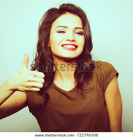 Happy woman giving thumb up. Life style picture.