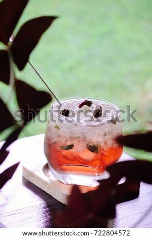 One cup of rose tea with ice serve in the garden for morning tea