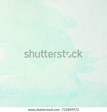 Blue and green abstract watercolor painting textured on white paper background