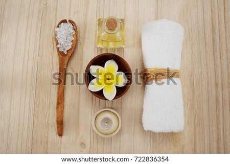 spa treatment with oil, ball , candle,towel , salt in bowl 