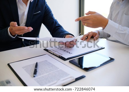 Sales manager giving advice application form document, considering mortgage loan offer for car and house insurance Royalty-Free Stock Photo #722846074