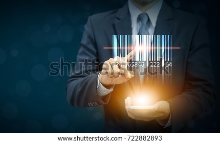 businessman show barcode with glow light on hand, warehouse and logistics Royalty-Free Stock Photo #722882893