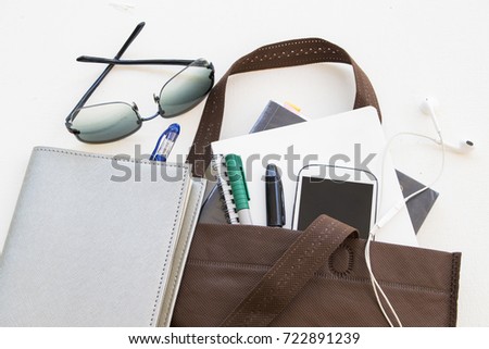 education book in bag prepare go to study on table white