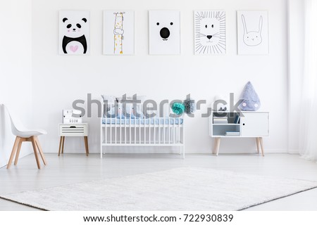 Boy's bed between white cabinet and violet tear pillow on cupboard in bedroom with gallery
