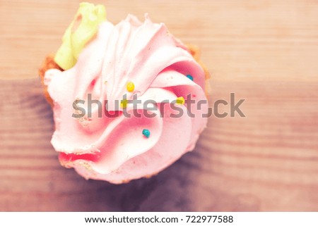 sweet pink cupcake. close up. toned image