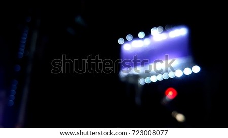 Blur billboard at night with bokeh light effect, sighting of myopic people concept.