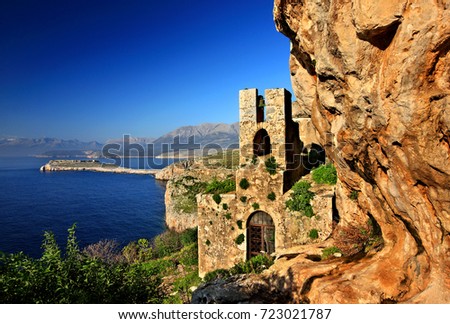 MANI, PELOPONNESE, GREECE.
The "hidden" byzantine church of Agitra (also known as "Panagia Odigitria") with Cape Tigani in the background. Mani region, Lakonia prefecture, Peloponnese, Greece  Royalty-Free Stock Photo #723021787