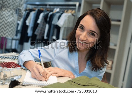 clothing boutique manager doing her work