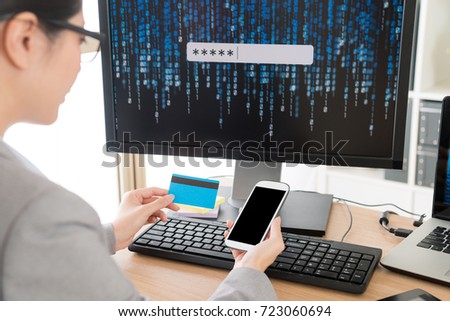 selective focus photo of young beauty female office worker developed online account protection system and using mobile smartphone checking credit card personal e-commerce information.
