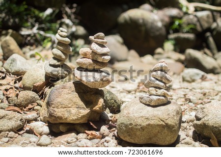 The concept of balance and harmony. Rocks on the coast of the waterfall at the jungle.