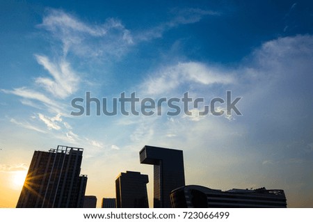 Blue sky sunset and cloud with shadow of buildings and sunlight