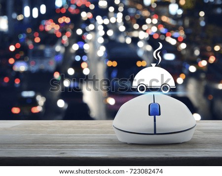 Restaurant cloche flat icon with wireless computer mouse on wooden table over blurred colourful night light city with cars, Food delivery concept
