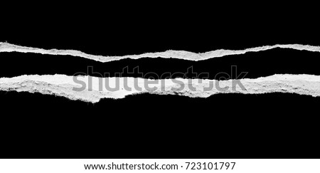 Ripped paper on black background, space for advertising copy. Royalty-Free Stock Photo #723101797