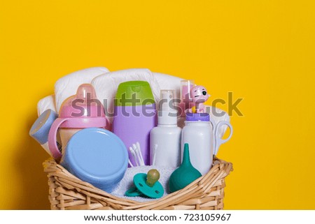basket full of baby care accessories - motherhood