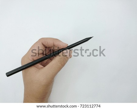Pencil writing gesture on white paper,drawing action,selected focus.