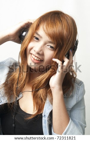 Portrait of happy girl pose with her headphone