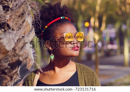 African Lady with Zulu Hairband on Her Afro Wearing Sunglasses