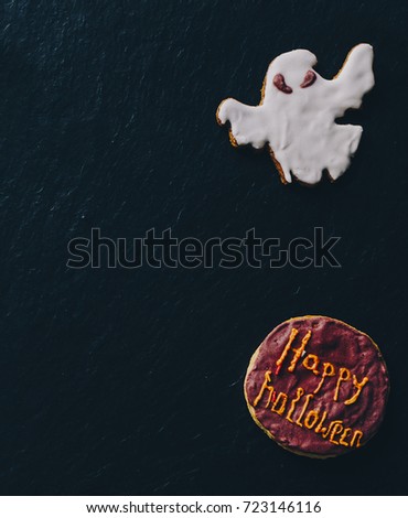 Halloween cookies on black stone desk