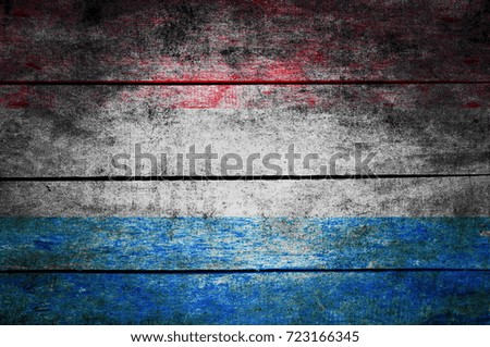wooden texture surface with old painted flag
