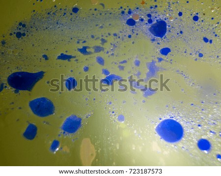 Watercolor paint dissolves in water droplets on the glass, backlighting from different directions, large magnification, bokeh, Colored abstractions