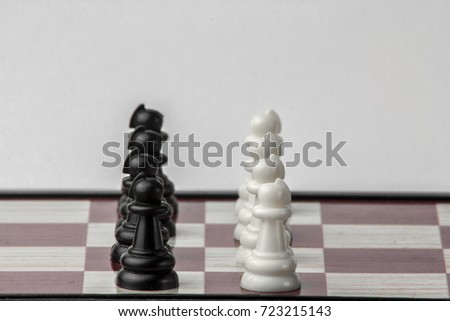 chess black and white pawns face to face. concept of struggle. Isolated on white background.