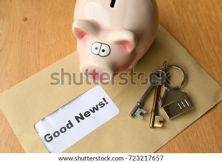 Concept of good news with piggy bank house keys and an envelope with good news inside