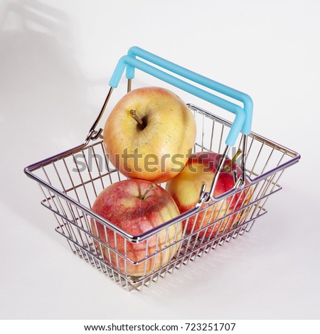 the Shopping basket with apple isolated on white background