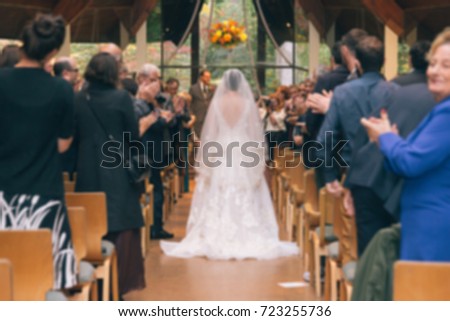 Blurred Picture of Bride Walking Down Aisle in Church