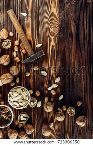 Dried nut is useful and natural on a wooden substrate. Appetizing