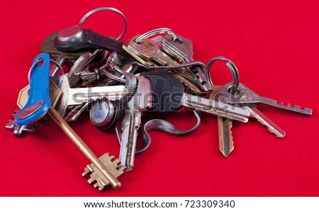 a bunch of keys close-up on a red background