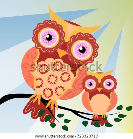 A couple of owls on a green branch of a tree in the sunlight, mom and baby. Two owls on a fantastic tree branch, decorated with flowers.